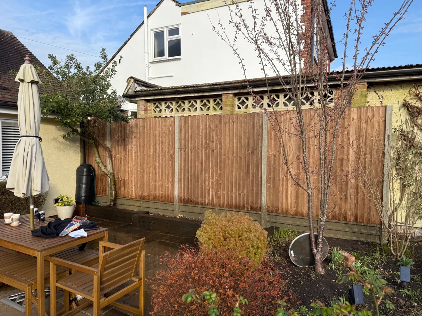 Closeboard fencing and gravel boards behind a patio in Surrey